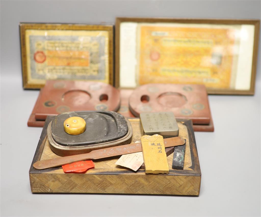 A group of Chinese and Japanese objects, 19th/20th century, including an inscribed ink box an inkstone, a lacquer bookslide, two Tibeta